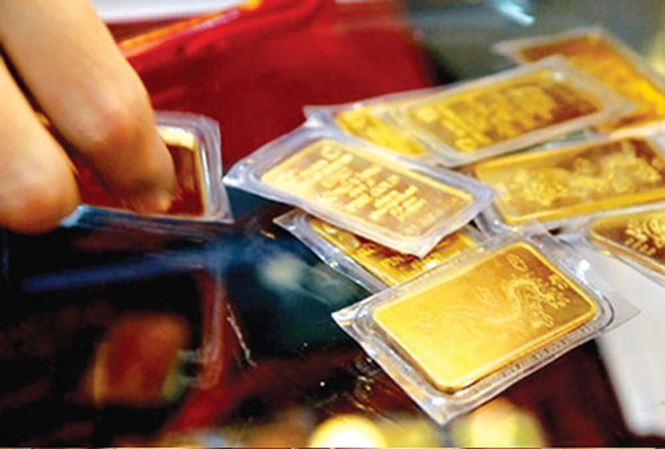 Giá vàng hôm nay 6/3: Giá vàng giảm, tỷ giá sát ngưỡng 22.800 đồng - 1