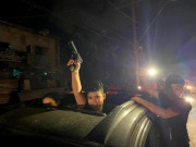 Chùm ảnh: Người dân Dải Gaza cầm súng ra đường mừng thỏa thuận ngừng bắn