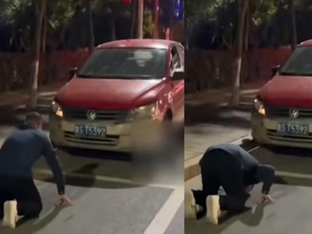 Người đàn ông dừng xe rồi quỳ lạy trước ô tô, nguyên nhân khiến ai nấy đều bất ngờ