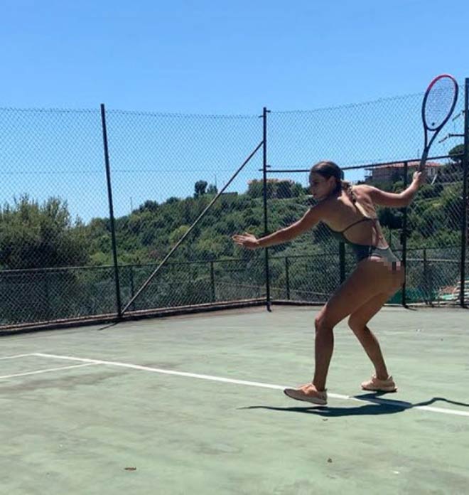 A fragile bikini beauty plays tennis, 
