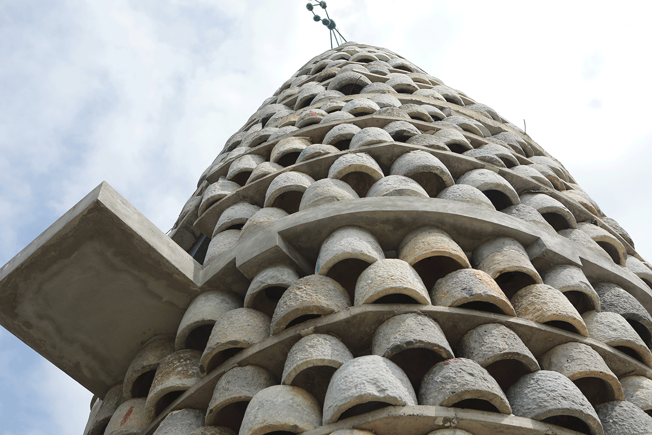 Ảnh: Chiêm ngưỡng tháp hình hạt lúa ghép bằng cối đá vừa đạt kỷ lục châu Á - 4