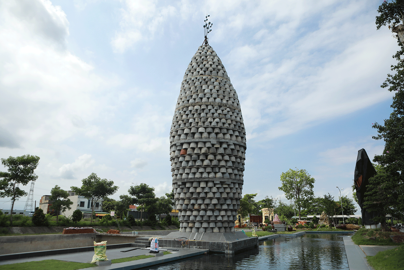 Ảnh: Chiêm ngưỡng tháp hình hạt lúa ghép bằng cối đá vừa đạt kỷ lục châu Á - 5
